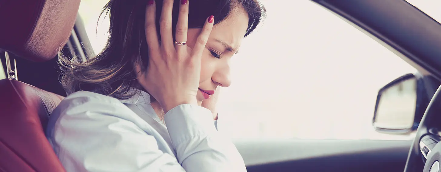Female with a headache after a car crash